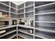 Organized walk-in pantry with ample shelving for storage and a variety of small appliances at 3510 Myrtle St, Edisto Island, SC 29438