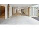 Spacious underneath of house featuring concrete floors, ceiling lights and covered parking at 3510 Myrtle St, Edisto Island, SC 29438