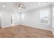 Spacious bedroom featuring two windows, ceiling fan, and wood flooring at 355 Wappoo Trace Ln, Summerville, SC 29486