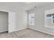 This bedroom features plush carpet, natural light from the window, and a closet with sliding doors at 355 Wappoo Trace Ln, Summerville, SC 29486