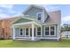 Back of the house with a covered porch and white pillars at 355 Wappoo Trace Ln, Summerville, SC 29486