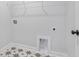 Laundry room with overhead shelving, stylish flooring and appliances ready for hookup at 355 Wappoo Trace Ln, Summerville, SC 29486