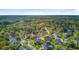 Breathtaking aerial view of a residential area with mature trees, a pond, and manicured green spaces at 3584 Somerset Hills Ct, Mount Pleasant, SC 29466