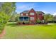 Expansive backyard features a screened-in porch and a well-maintained lawn, perfect for outdoor living at 3584 Somerset Hills Ct, Mount Pleasant, SC 29466