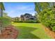 Large backyard with lush lawn and privacy hedge at 3584 Somerset Hills Ct, Mount Pleasant, SC 29466