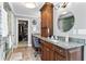 Bathroom featuring a dark wood vanity with granite countertops, a sink, and a walk in closet at 3584 Somerset Hills Ct, Mount Pleasant, SC 29466