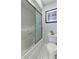 Bathroom features a shower-tub combo with patterned flooring and framed sailboat art at 3584 Somerset Hills Ct, Mount Pleasant, SC 29466