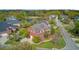 Beautiful brick home featuring mature landscaping, attached garage, and views of the lake at 3584 Somerset Hills Ct, Mount Pleasant, SC 29466