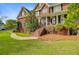Charming brick home featuring a manicured lawn, brick staircase, and covered front porch at 3584 Somerset Hills Ct, Mount Pleasant, SC 29466
