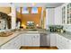 Bright kitchen with white cabinets, hardwood floors, stainless steel appliances, and open to the living room at 3584 Somerset Hills Ct, Mount Pleasant, SC 29466