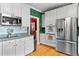 Bright kitchen with white cabinets, stainless steel appliances, and hardwood floors at 3584 Somerset Hills Ct, Mount Pleasant, SC 29466