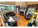 Open living room featuring a fireplace, hardwood floors, and views into the kitchen and dining areas at 3584 Somerset Hills Ct, Mount Pleasant, SC 29466