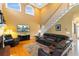 Spacious living room with high ceilings, hardwood floors, and a comfortable leather sectional sofa at 3584 Somerset Hills Ct, Mount Pleasant, SC 29466