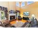 Inviting living room with a brick fireplace, high ceilings, and a comfortable seating arrangement at 3584 Somerset Hills Ct, Mount Pleasant, SC 29466