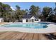 An inviting pool awaits next to an attractive pool house complete with a vending machine at 3584 Somerset Hills Ct, Mount Pleasant, SC 29466