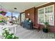 Screened-in porch features brick accents and comfortable outdoor seating at 3584 Somerset Hills Ct, Mount Pleasant, SC 29466