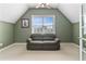 Cozy sitting room with a comfortable couch and a view of the lush outdoors from a bright sunny window at 3584 Somerset Hills Ct, Mount Pleasant, SC 29466