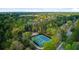Aerial view of multiple community tennis courts nestled among lush greenery and mature trees at 3584 Somerset Hills Ct, Mount Pleasant, SC 29466