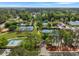 Aerial shot of neighborhood featuring recreational facilities, tennis courts, and lush landscaping at 402 N Hickory Street St, Summerville, SC 29483