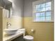 Bathroom featuring tiled walls, a modern toilet, and a vessel sink at 402 N Hickory Street St, Summerville, SC 29483