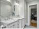 Bright bathroom with marble countertops, double vanity, and white cabinets, providing ample storage at 402 N Hickory Street St, Summerville, SC 29483