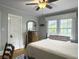 Charming bedroom with hardwood floors, a ceiling fan, and abundant natural light at 402 N Hickory Street St, Summerville, SC 29483