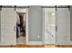 A view of two closets, one used for clothing storage, and another exposing a bathroom at 402 N Hickory Street St, Summerville, SC 29483