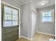 Light and airy entryway with storage closet and view of outdoors through window above door at 402 N Hickory Street St, Summerville, SC 29483