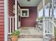 Inviting front porch with outdoor seating and charming curb appeal at 402 N Hickory Street St, Summerville, SC 29483