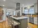 Bright kitchen features an island with seating, butcher block counters, stainless steel appliances, and hardwood flooring at 402 N Hickory Street St, Summerville, SC 29483