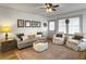 Cozy living room offers a comfortable sofa, armchairs, and vintage decor at 402 N Hickory Street St, Summerville, SC 29483