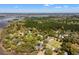 Beautiful aerial view of waterfront homes nestled among lush trees with marsh views in the background at 4029 Gift Blvd, Johns Island, SC 29455