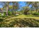 Serene backyard setting with sprawling lawn and mature trees, creating a peaceful and private outdoor oasis at 4029 Gift Blvd, Johns Island, SC 29455