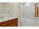 Bathroom featuring vanity with wood cabinets, stylish fixtures and a shower-tub with marble surround at 4029 Gift Blvd, Johns Island, SC 29455