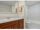 Well-lit bathroom featuring a vanity with marble countertop, and a marble-tiled shower-tub combo at 4029 Gift Blvd, Johns Island, SC 29455