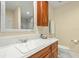 Bathroom showcasing a white countertop, vanity with wood cabinets and a tiled shower at 4029 Gift Blvd, Johns Island, SC 29455