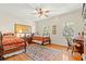 Comfortable bedroom featuring two twin beds, hardwood floors, and a bright, inviting atmosphere at 4029 Gift Blvd, Johns Island, SC 29455