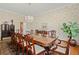 Elegant dining room features a large wooden table, chandelier, and sophisticated decor, ideal for Gathering gatherings at 4029 Gift Blvd, Johns Island, SC 29455