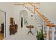 Elegant foyer featuring marble floors, a wooden staircase, and sophisticated decor; providing a grand entrance at 4029 Gift Blvd, Johns Island, SC 29455