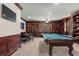 Entertaining game room with a pool table, game table, and handsome custom wood shelving at 4029 Gift Blvd, Johns Island, SC 29455