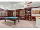 Spacious game room featuring a billiard table, custom built-in bookshelves, and ample seating at 4029 Gift Blvd, Johns Island, SC 29455