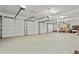 Spacious garage featuring multiple doors, ample lighting, and concrete flooring, perfect for storage and projects at 4029 Gift Blvd, Johns Island, SC 29455