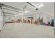 Large garage interior with concrete floors, storage boxes, and stair access, ready for customization and organization at 4029 Gift Blvd, Johns Island, SC 29455