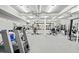 A spacious workout room with mirrored walls, ceiling fans, padded floors, and an array of exercise equipment at 4029 Gift Blvd, Johns Island, SC 29455