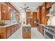 Spacious kitchen features custom wood cabinetry, a center island, white marble floors, and stainless steel appliances at 4029 Gift Blvd, Johns Island, SC 29455