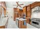 Bright kitchen showcasing the center island, wine fridge, stainless steel appliances, and custom wood cabinets at 4029 Gift Blvd, Johns Island, SC 29455