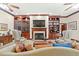 Bright living room features a cozy fireplace and custom built-ins at 4029 Gift Blvd, Johns Island, SC 29455
