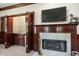 Wet bar next to fireplace with a tile surround and adjacent wet bar with beautiful wood cabinetry at 4029 Gift Blvd, Johns Island, SC 29455