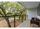 Balcony with outdoor seating and a view of mature trees at 4060 S Rhett Ave, North Charleston, SC 29405