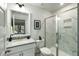Modern bathroom featuring a glass-enclosed shower with marble tile, sleek vanity, and stylish fixtures at 4060 S Rhett Ave, North Charleston, SC 29405